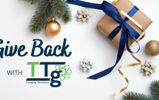 Christmas present next to TTG give back text